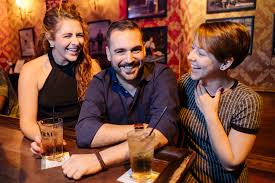 bar man with 2 ladies