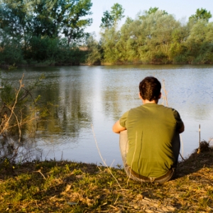 man thinking at lake